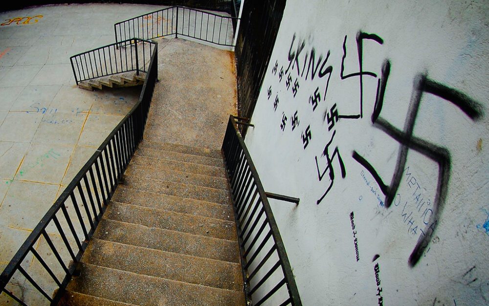 stairs with nazi symbol spraypainted on wall
