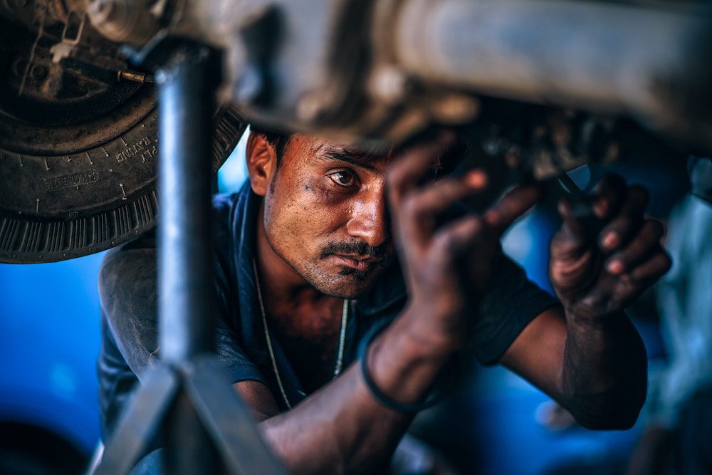 mechanic at work on a car