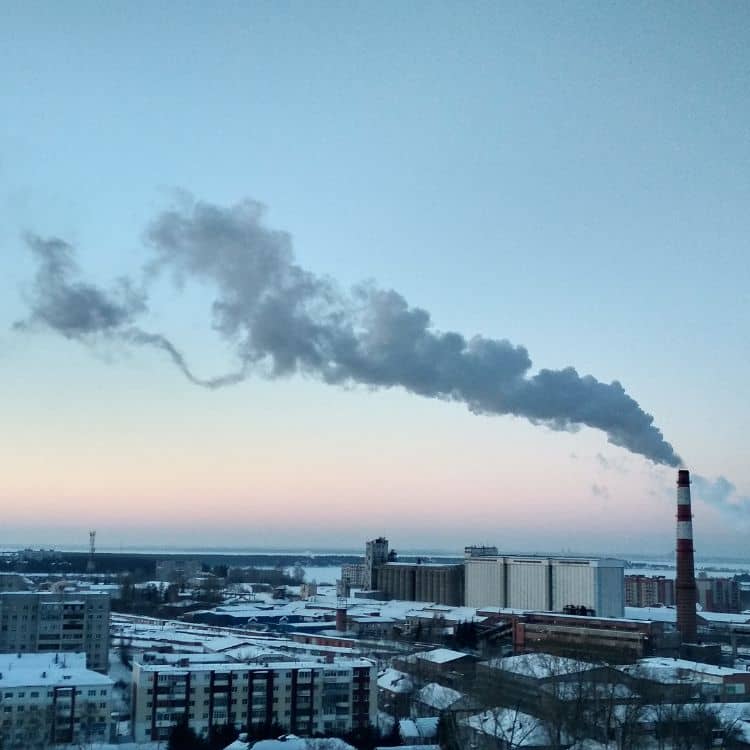 Industrial skyline with smokestack